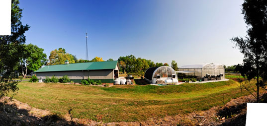 A panoramic view of the greenhouses and barns